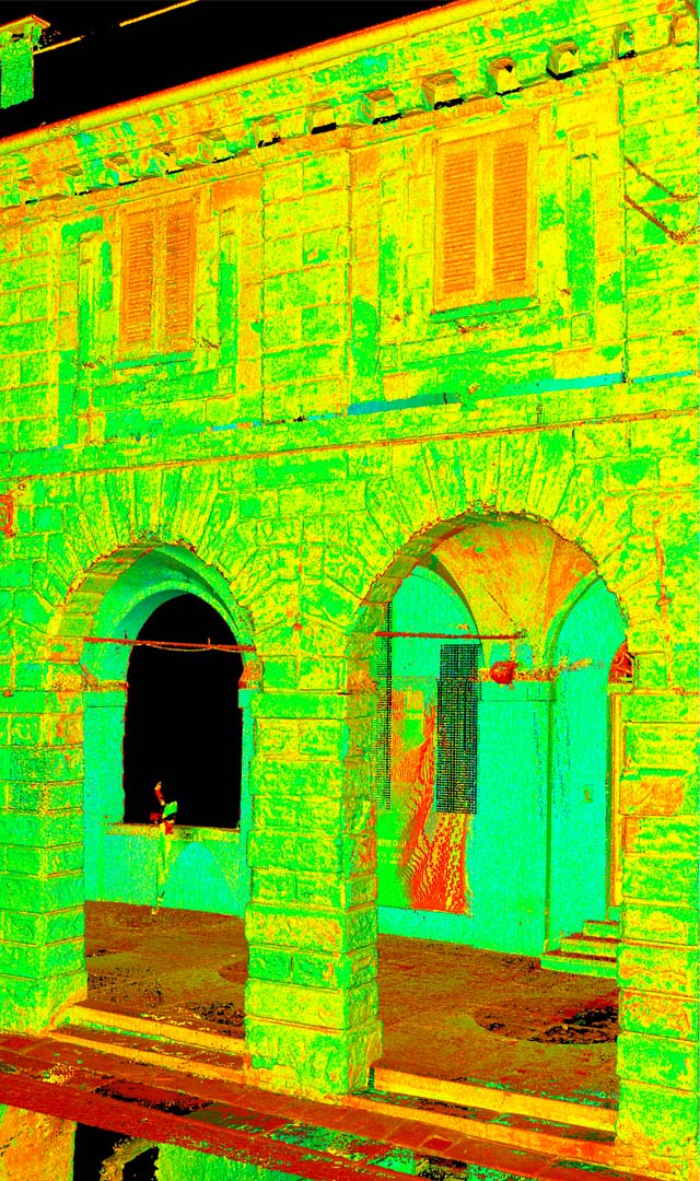 Pescherie by Giulio Romano, Mantua. Thermographic visualization or LiDAR scan model of a historic façade with masonry arches. The image uses vivid false-color mapping (green, red, yellow, blue) to highlight surface variations or geometric deformations. Windows, arches, and columns are clearly identifiable in a frontal perspective.