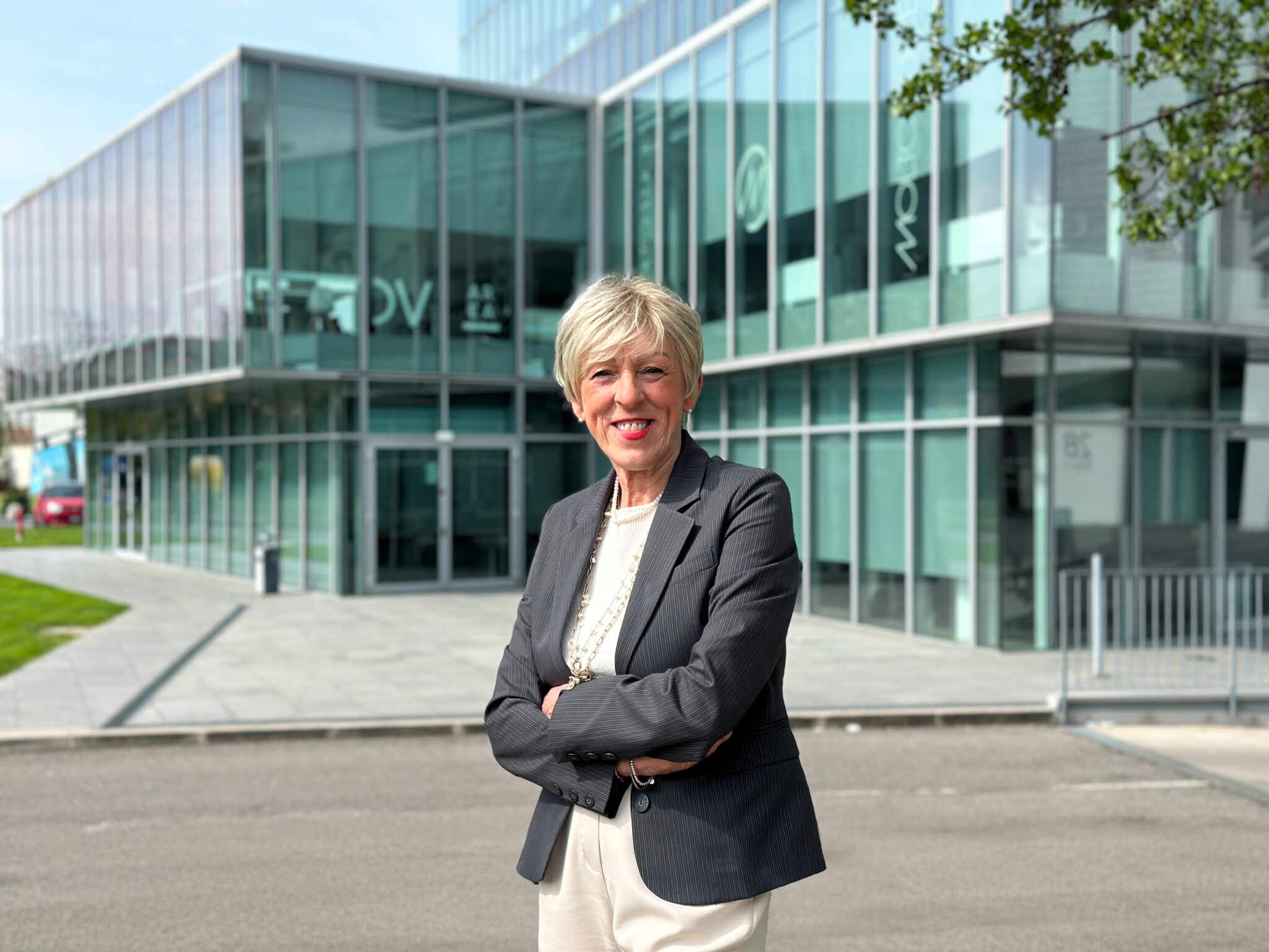 Image of our receptionist Grazia Arcari in front of DVArea's headquarters in Brescia.