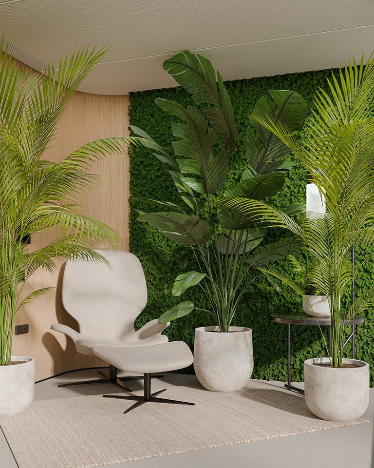 Modern relaxation area with light-colored designer armchair, potted plants, and a vertical green moss wall.