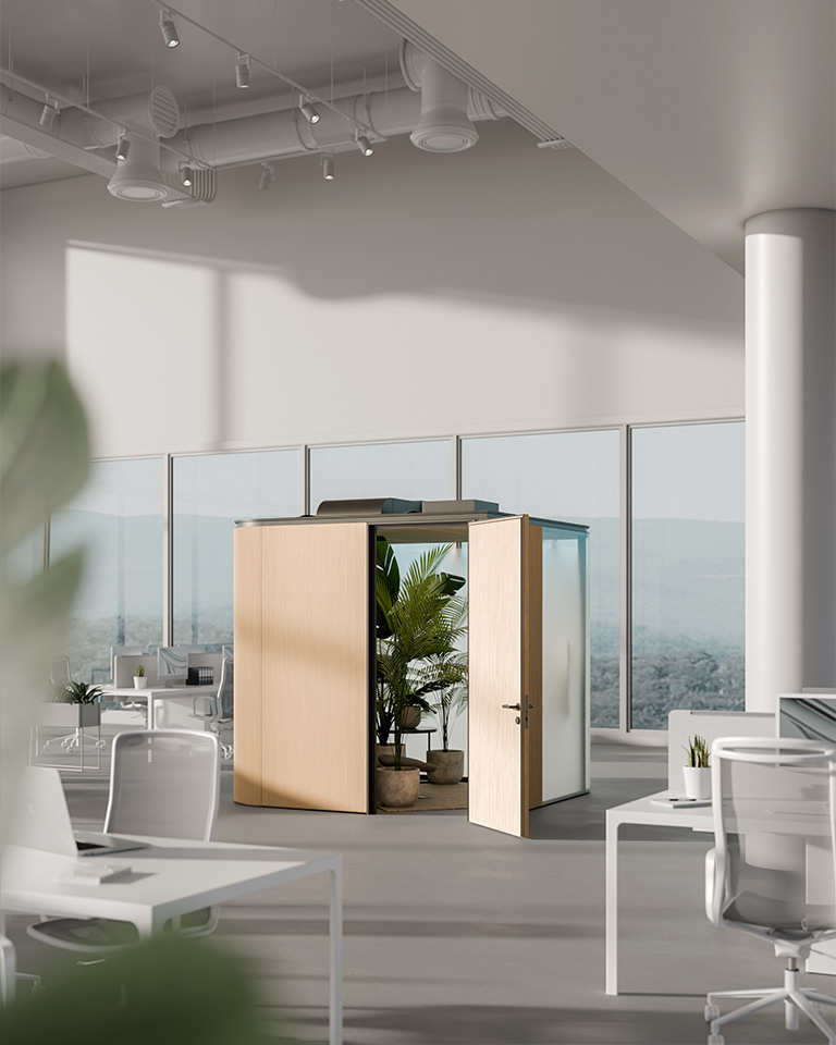 Modern office space with glass walls and minimal furnishings, featuring an open wooden pod with green plants at its center, designed as a wellness area.